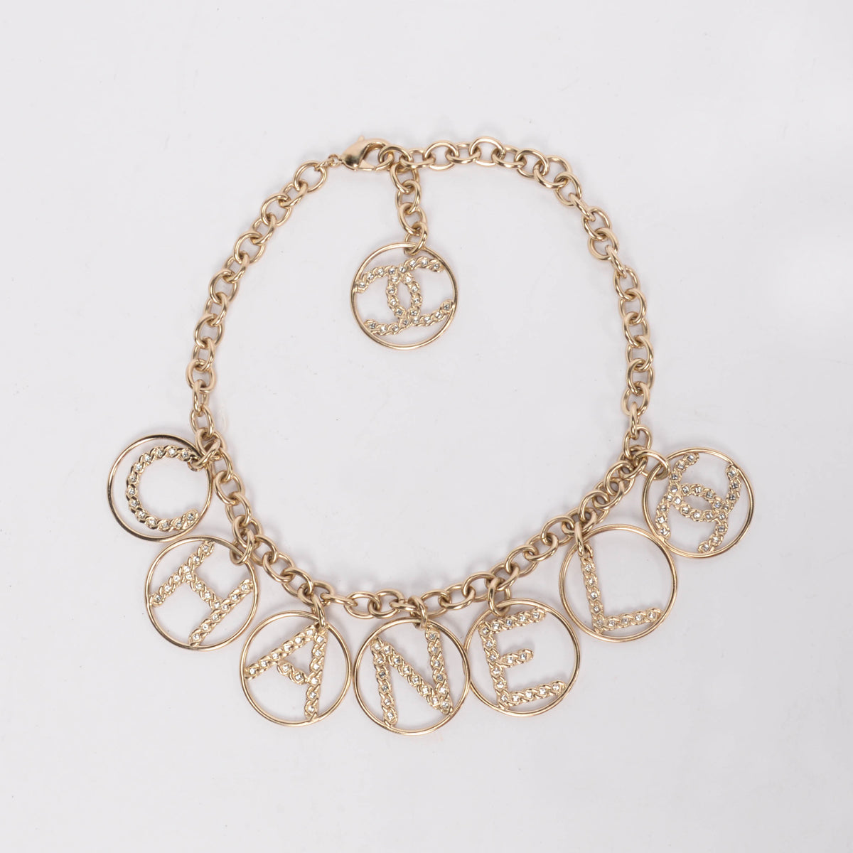 Chanel Light Gold Crystal Logo Spellout Necklace