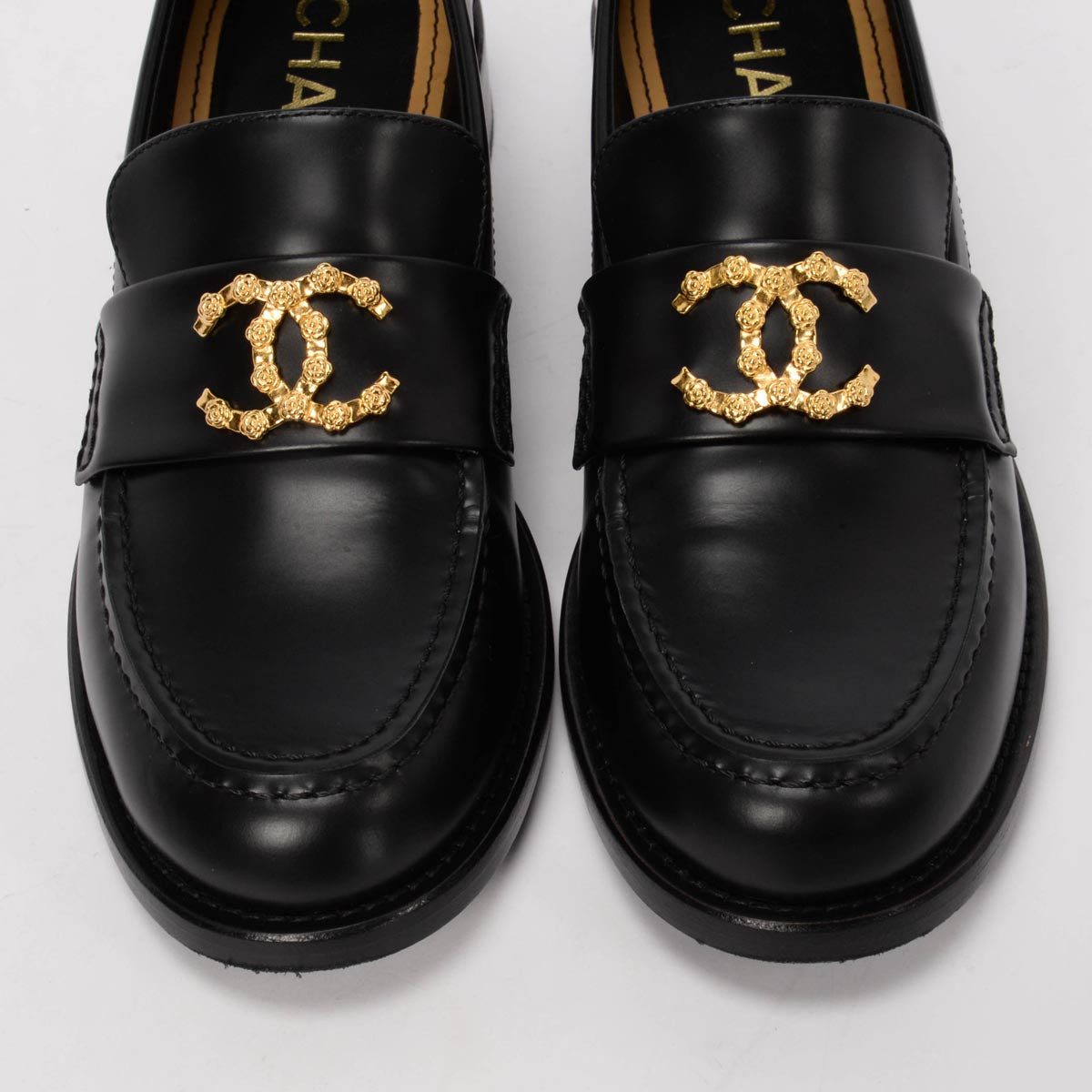 Chanel Black Smooth Calfskin CC Camellia Loafers 37