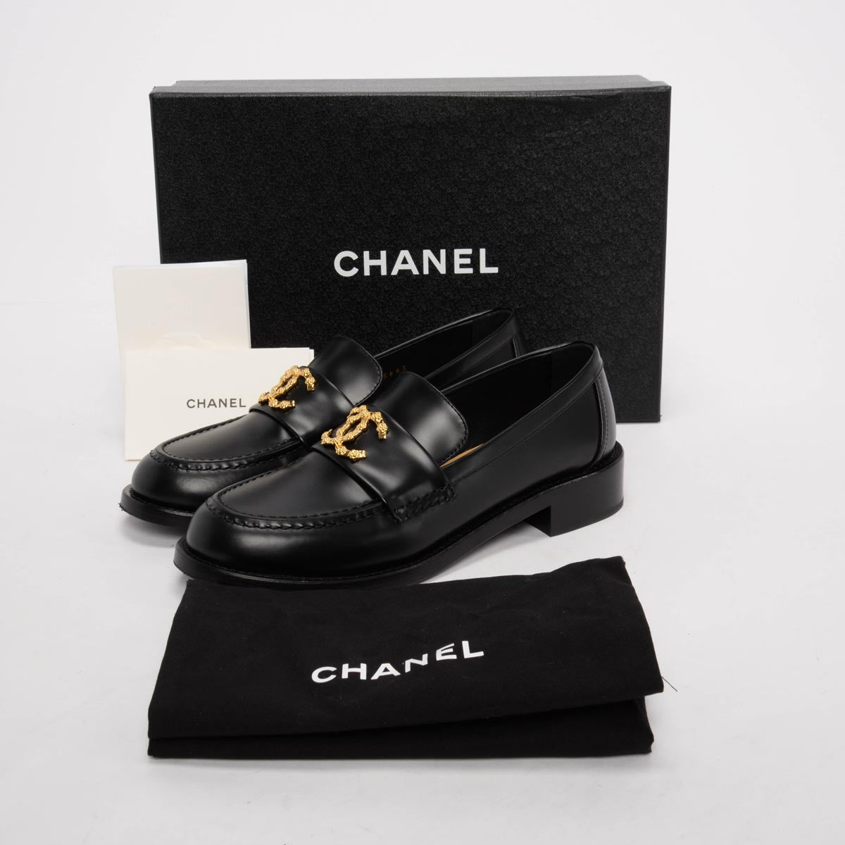 Chanel Black Smooth Calfskin CC Camellia Loafers 37